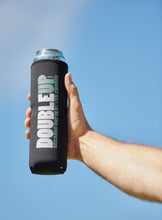 Load image into Gallery viewer, Hand holding a black color double can cooler