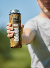 Load image into Gallery viewer, Hand holding a camo. color double can cooler
